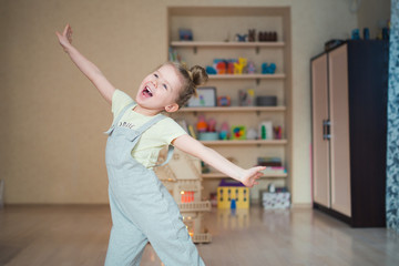 funny little girl singing and dancing in her room