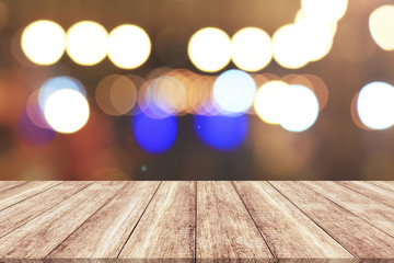 Wood table top with blurred light bokeh abstract background