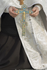 The cross in hand