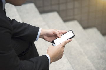 businessman using mobile phone. white screen.
