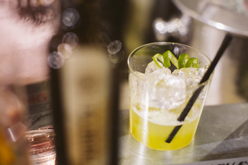 Barman preparing a gin and tonic.