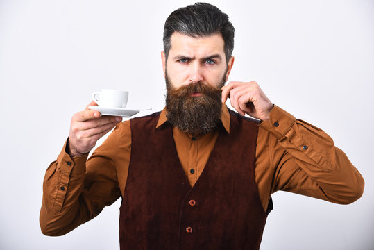 Barman with proud face serves coffee curling mustache.