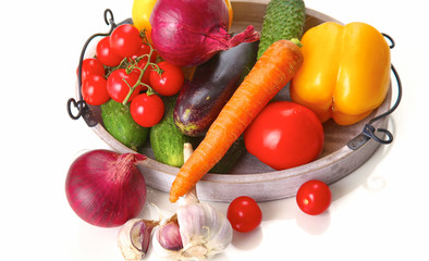 Fresh autumn vegetables on a white background