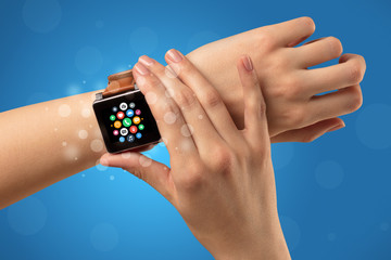 Female hand with smartwatch and app icons