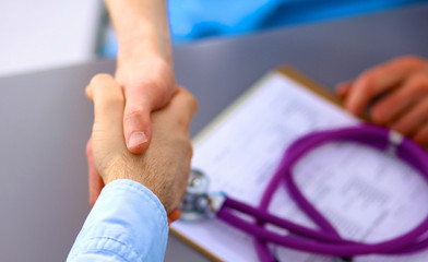 doctor and patient at the table. solution