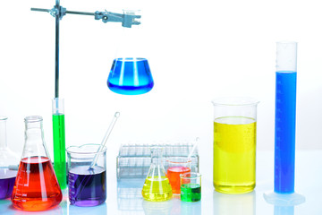 Laboratory glassware with colorful chemical reagent in research laboratory 
