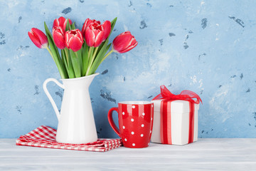 Red tulip flowers and gift box