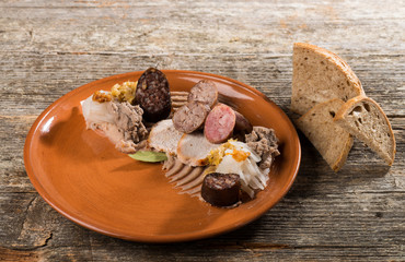 German food,  with sausages, steaks, potato and cabbage