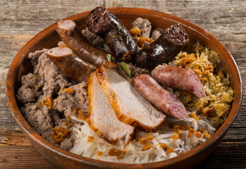 German food,  with sausages, steaks, potato and cabbage