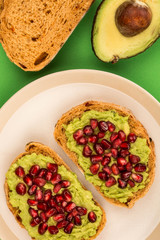 Avocado and Pomegranate Seeds Open Face Sandwich On Mediterranean Bread