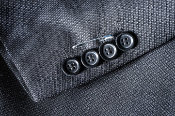 Closeup of suit buttons for business or formal wear