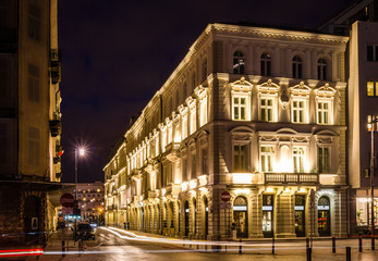 Fototapeta na wymiar Night view on the historic building at Prozna street in iWarsaw, Poland