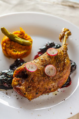 Roasted duck legs with jam and pumpkin puree vertical
