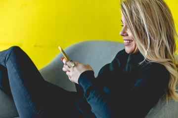 Beautiful woman looking at mobile phone