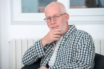 portrait of middle-aged man with beard and glasses