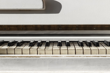 White pianoforte, front view instrument, musical instrument. learn to play the instrument at home....