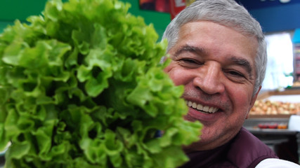 Senior Man Taking a Selfie with Lettuce