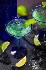 Fototapeta na wymiar Blue Margarita Alcoholic Cocktail. Selective focus.