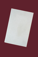 White blank hardcover book on red background