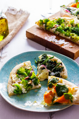 White pizza with vegetables. Italian cuisine side view