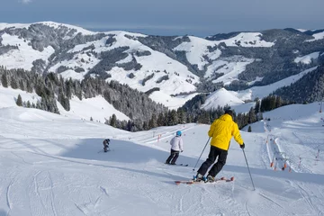 Schilderijen op glas Skier starts his journey in winter, with mountains in switzerland © brunok1
