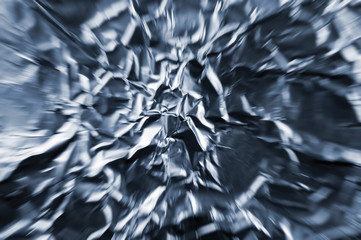 Abstract zoom tunnel, crumpled silver aluminum foil closeup background pattern, horizontal texture, grey, blue textured macro