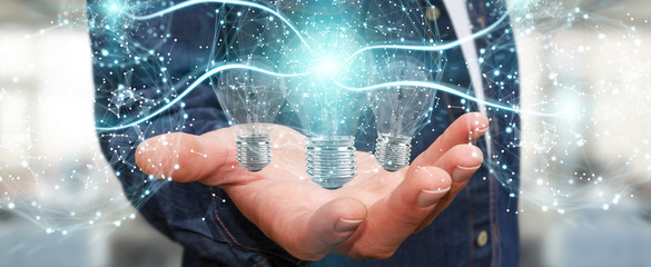 Businessman connecting modern lightbulbs with connections 3D rendering