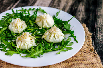 Kinkali from cheese with arugula Georgian cuisine