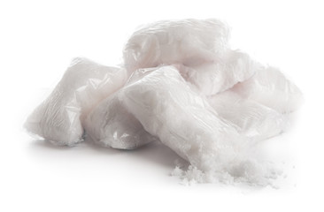 Salt in the plastic bag on white background