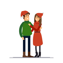 Couple of young people on Christmas Day. Husband and wife celebrate winter holiday. Young family standing together holding each other.