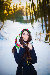 Fototapeta na wymiar Lovely girl wears a white scarf in the park