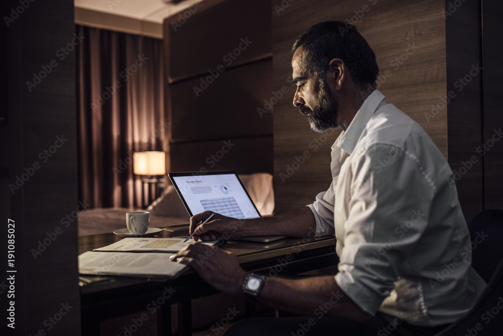 Wall mural businessman working late