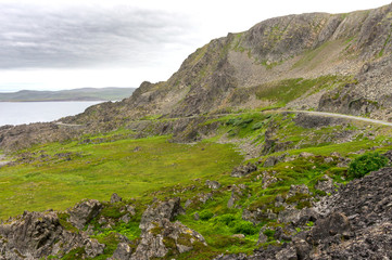 Fototapeta na wymiar Rocky cliffs along the Varanger National Tourist Route, Finnmark, Norway