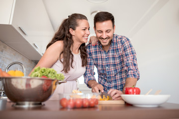 Couple having fun from preparing food together.