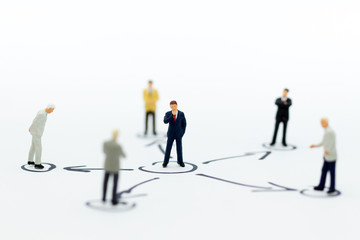 Miniature people: Businessman stand in various positions. Image use for business cycle, responsibility.