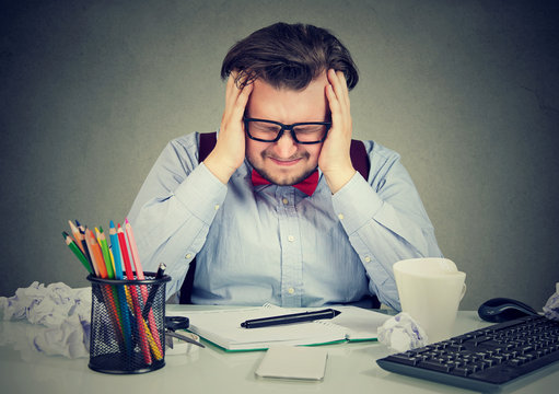 Stressful man having problems at work