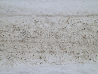 car footprints in the snow