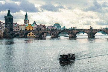 Fototapeta na wymiar Panoramic view of Charles Bridge in Prague in a beautiful autumn day, Czech Republic. Concept of Europe travel, sightseeing and tourism.