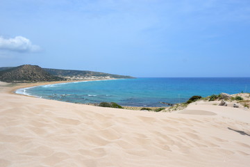 Dunes at coast of Mediterranean Sea named Golden Beach with white sand and warm waves at Karpaz Area on Cyprus island.