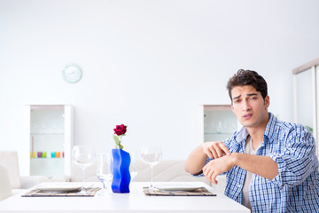Man alone preparing for romantic date with his sweetheart