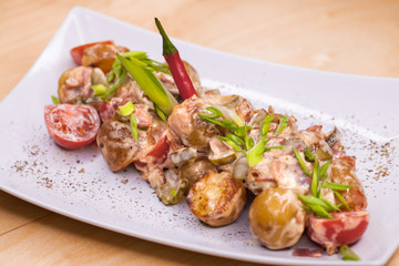 Roasted potatoes with vegetables and mushrooms