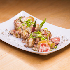 Roasted potatoes with vegetables and mushrooms