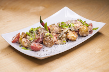 Roasted potatoes with vegetables and mushrooms