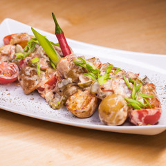 Roasted potatoes with vegetables and mushrooms