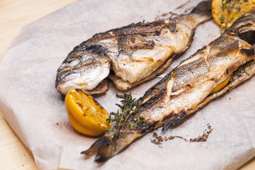 Restaurant dish two grilled fish Dorado and Seabass