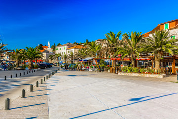 Obraz premium Rogoznica Mediterranean riva scenery. / Scenic view at mediterranean promenade in center of town Rogoznica, picturesque tourist resort on Adriatic Coast, Croatia.