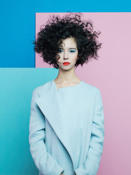 Fashion Portrait Of Beautiful Asian Woman In Sky-blue Coat