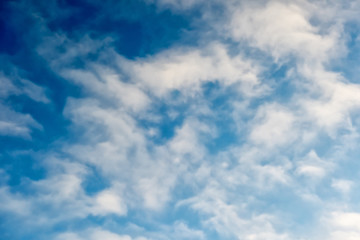 Naklejka na ściany i meble Beautiful bright blue sky background with white fluffy clouds