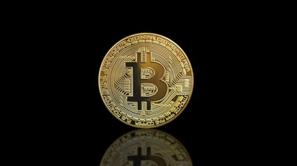 Bitcoin coin - a golden Bitcoin coin on black mirror surface