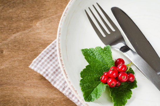 Fresh ripe organic red currant in plate.